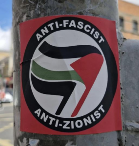 Sticker of Anti Fascist Anti Zionist on a street pole